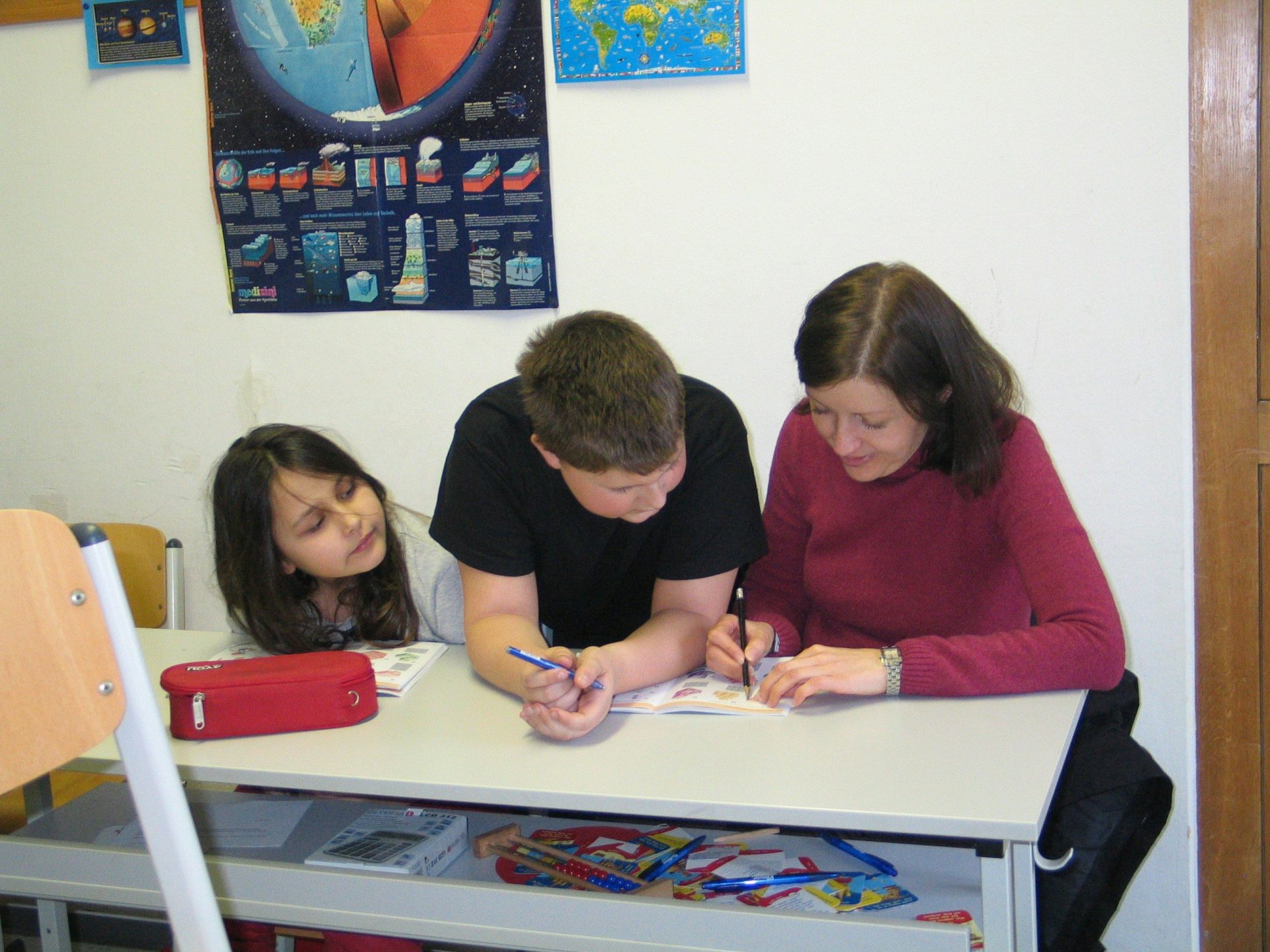 a group of people sitting at a table